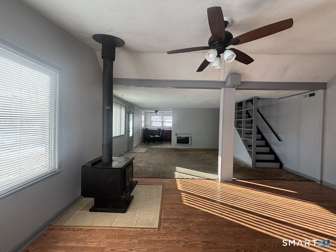 34 Seaver Circle Bridgeport, CT 06606 - Photo 2 of 18 a view of an entryway with wooden floor