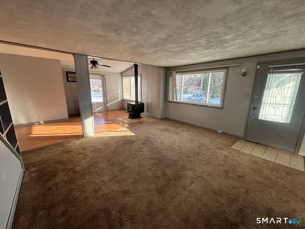 a view of an empty room with a window