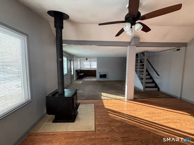 a view of an entryway with wooden floor