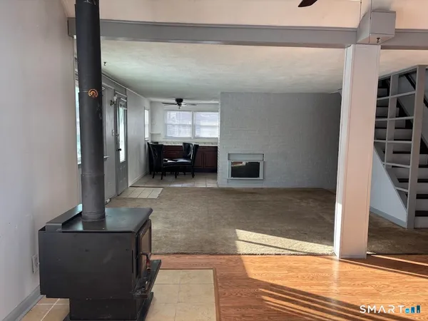 a view of living room with furniture and window