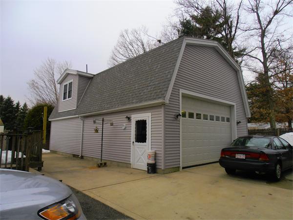 26 Flora Street Springfield, MA 01129 - Photo 3 of 30 a view of a house with a yard