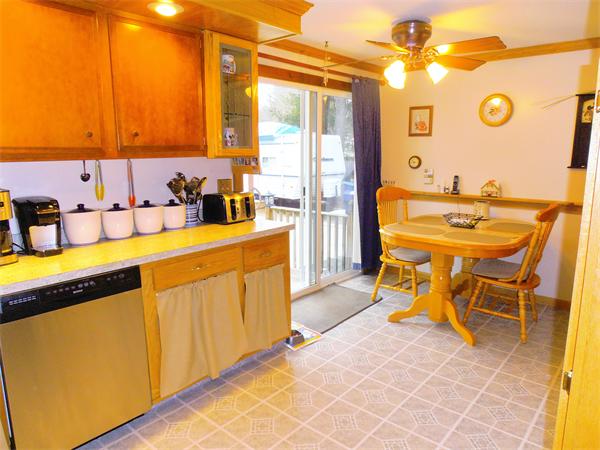 26 Flora Street Springfield, MA 01129 - Photo 8 of 30 a view of a kitchen with a table and chairs