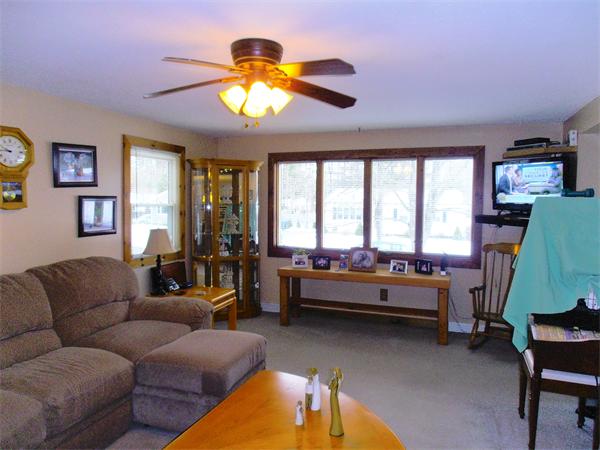 26 Flora Street Springfield, MA 01129 - Photo 10 of 30 a living room with furniture and a chandelier