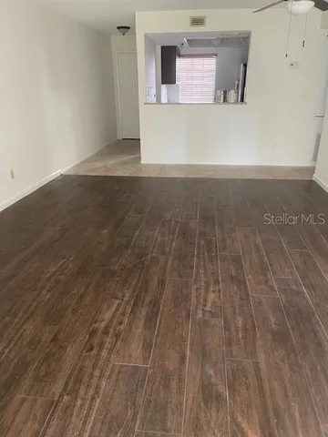 a view of a hardwood floor in a room