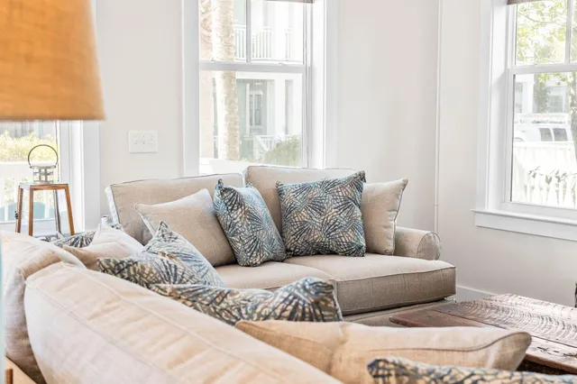 a living room with a couch and a large window