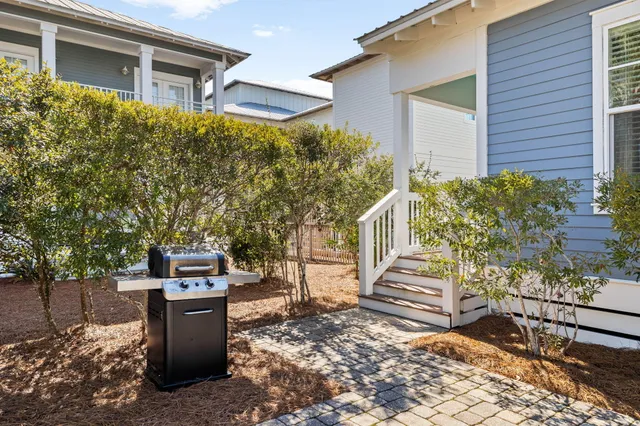 an aerial view of a house with a yard and potted plants