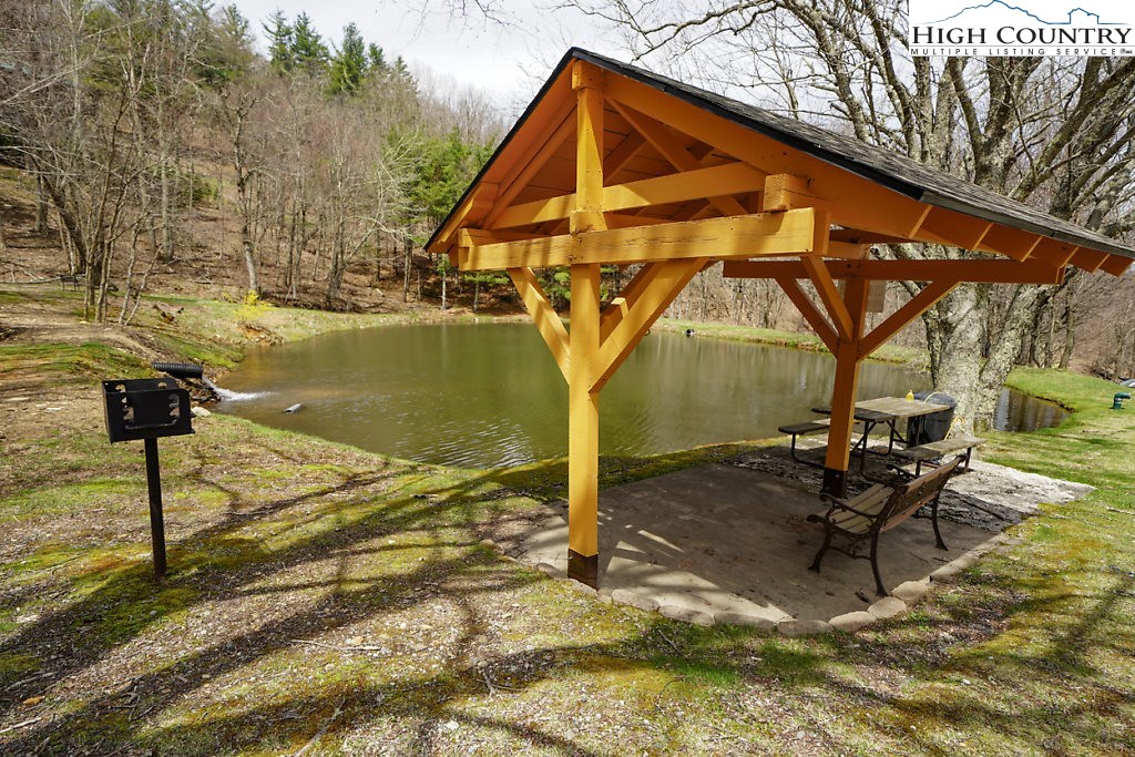 E-8 Fire Tower Road Boone, NC 28607 - Photo 12 of 25 a backyard of a house with table and chairs