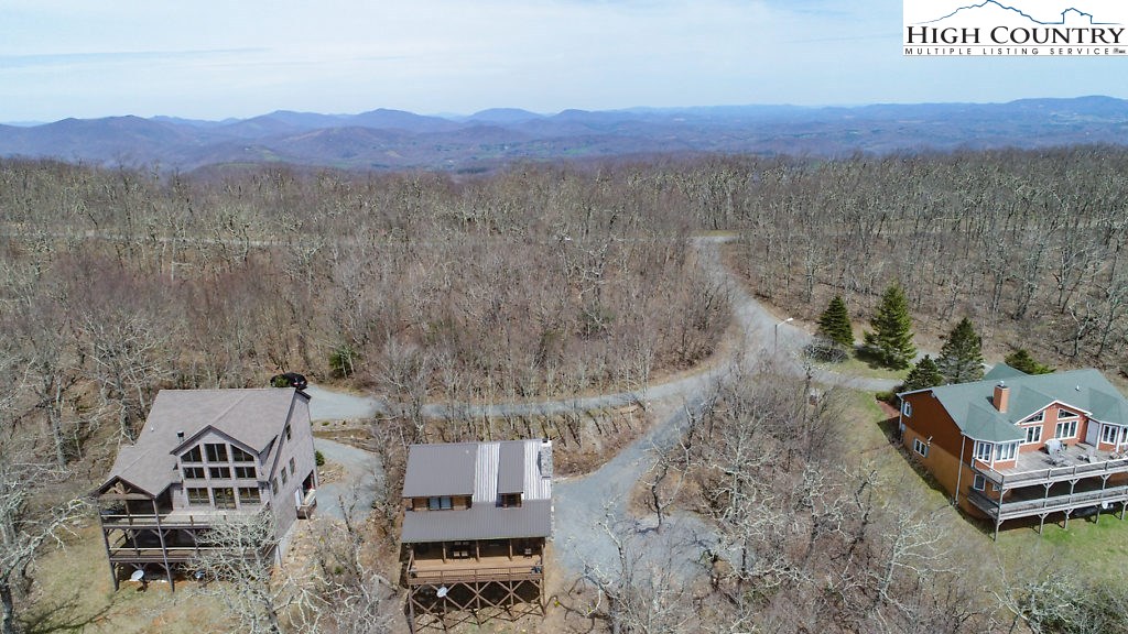 E-8 Fire Tower Road Boone, NC 28607 - Photo 2 of 25 a view of a terrace with a yard
