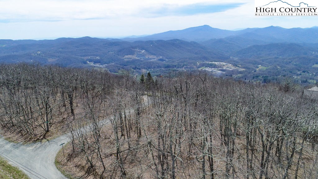E-8 Fire Tower Road Boone, NC 28607 - Photo 3 of 25 a view of a lush green hillside and a mountain