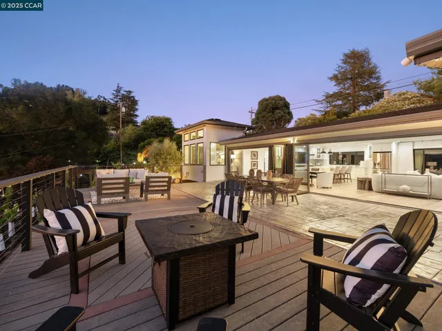 a view of a chairs and table on the deck