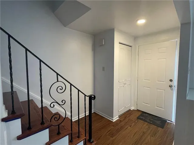 a view of an entryway with wooden floor