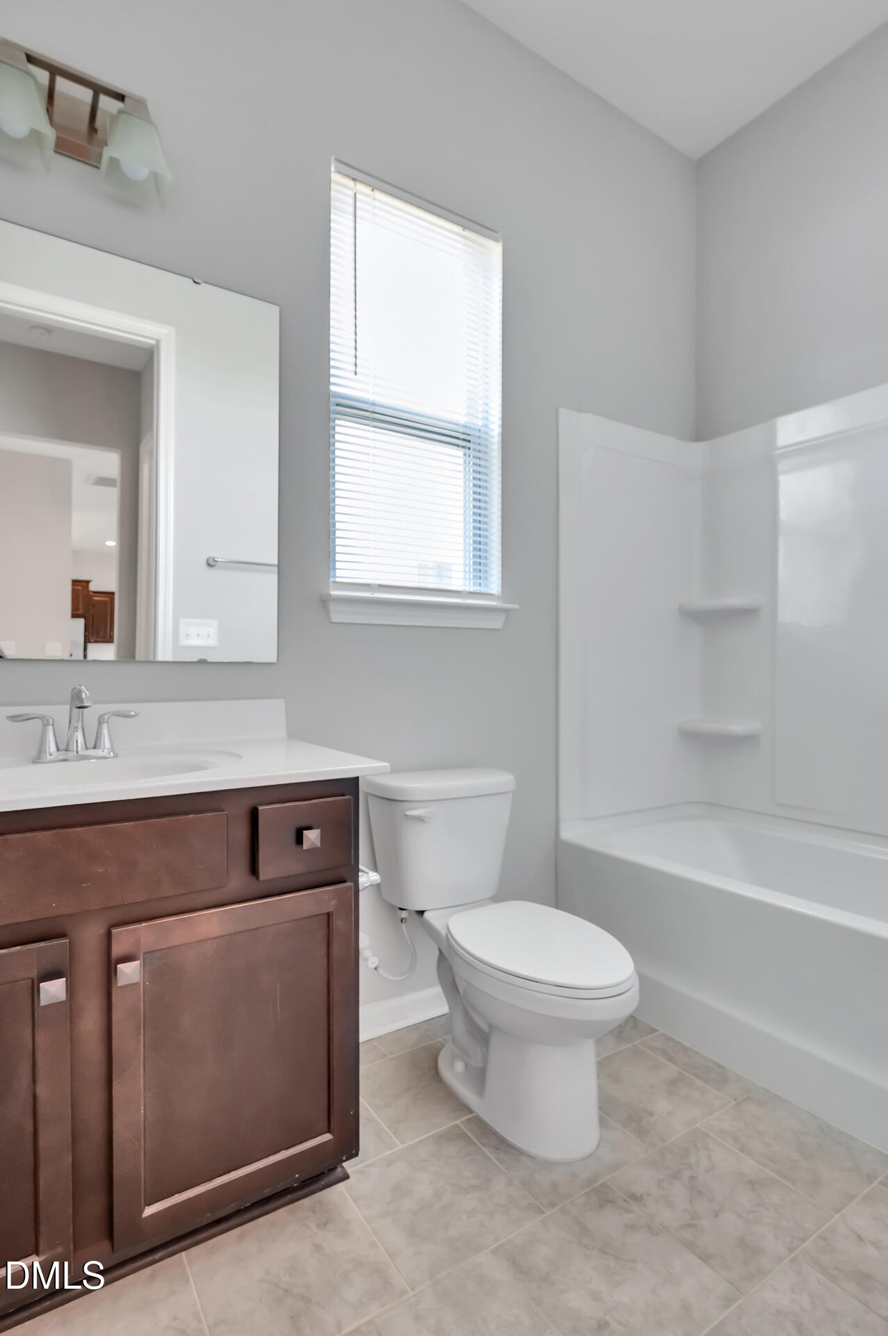 5406 Ripplebrook Drive Durham, NC 27712 - Photo 19 of 37 a bathroom with a toilet sink and mirror