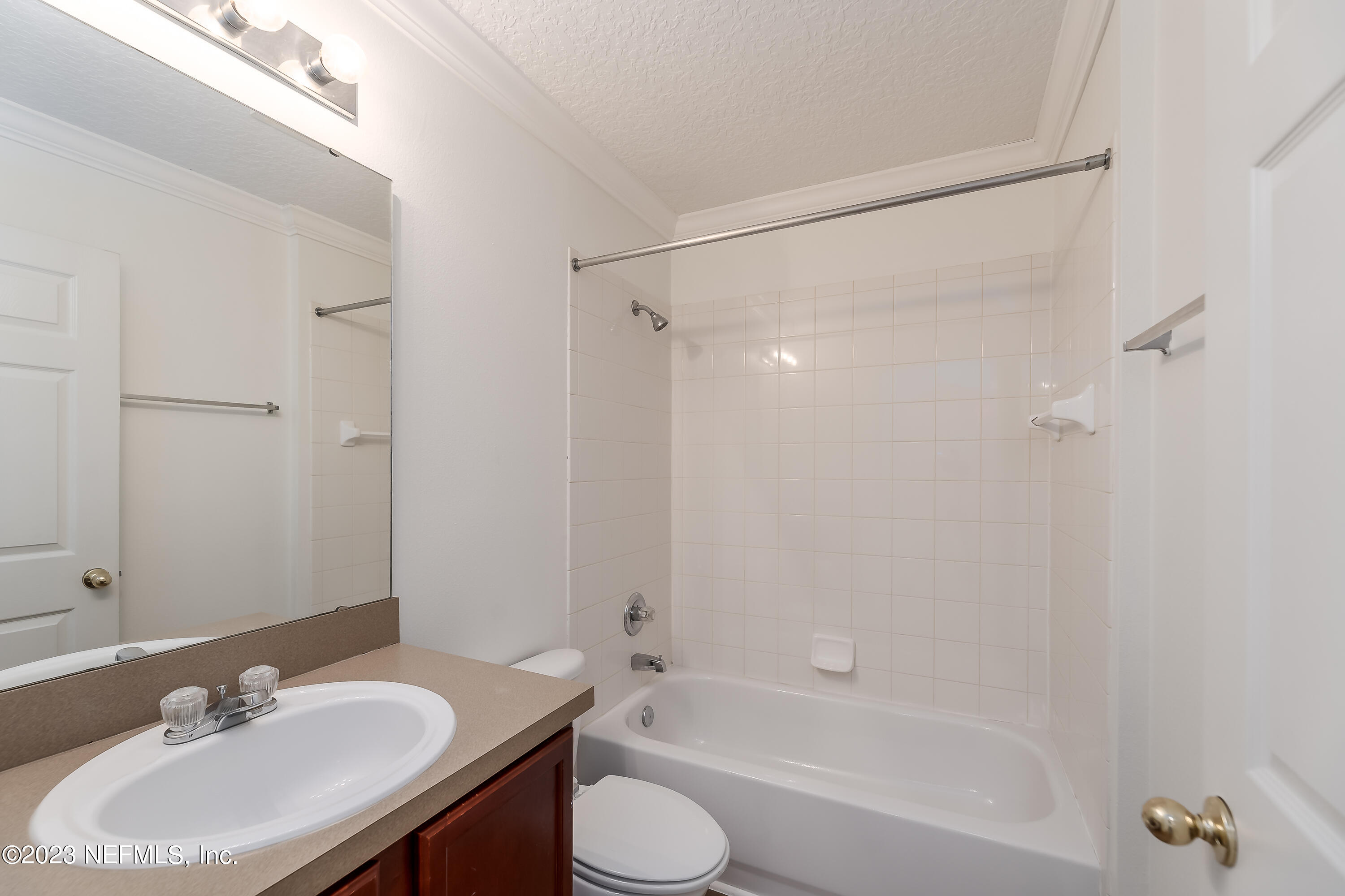 5260 Collins Road, Unit 1102 Jacksonville, FL 32244 - Photo 19 of 23 a bathroom with a sink toilet and shower