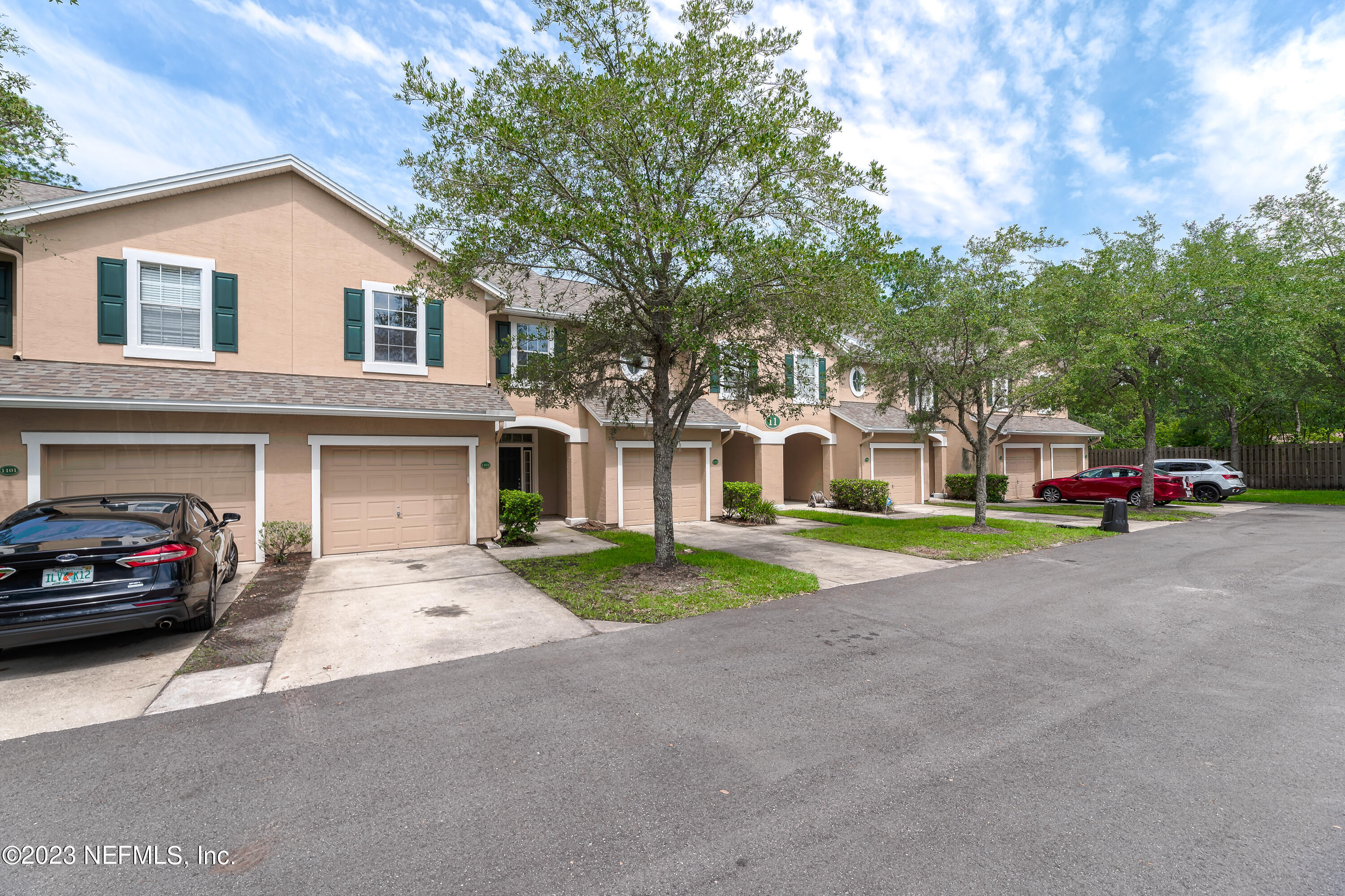 5260 Collins Road, Unit 1102 Jacksonville, FL 32244 - Photo 20 of 23 a view of a car parked in front of a house