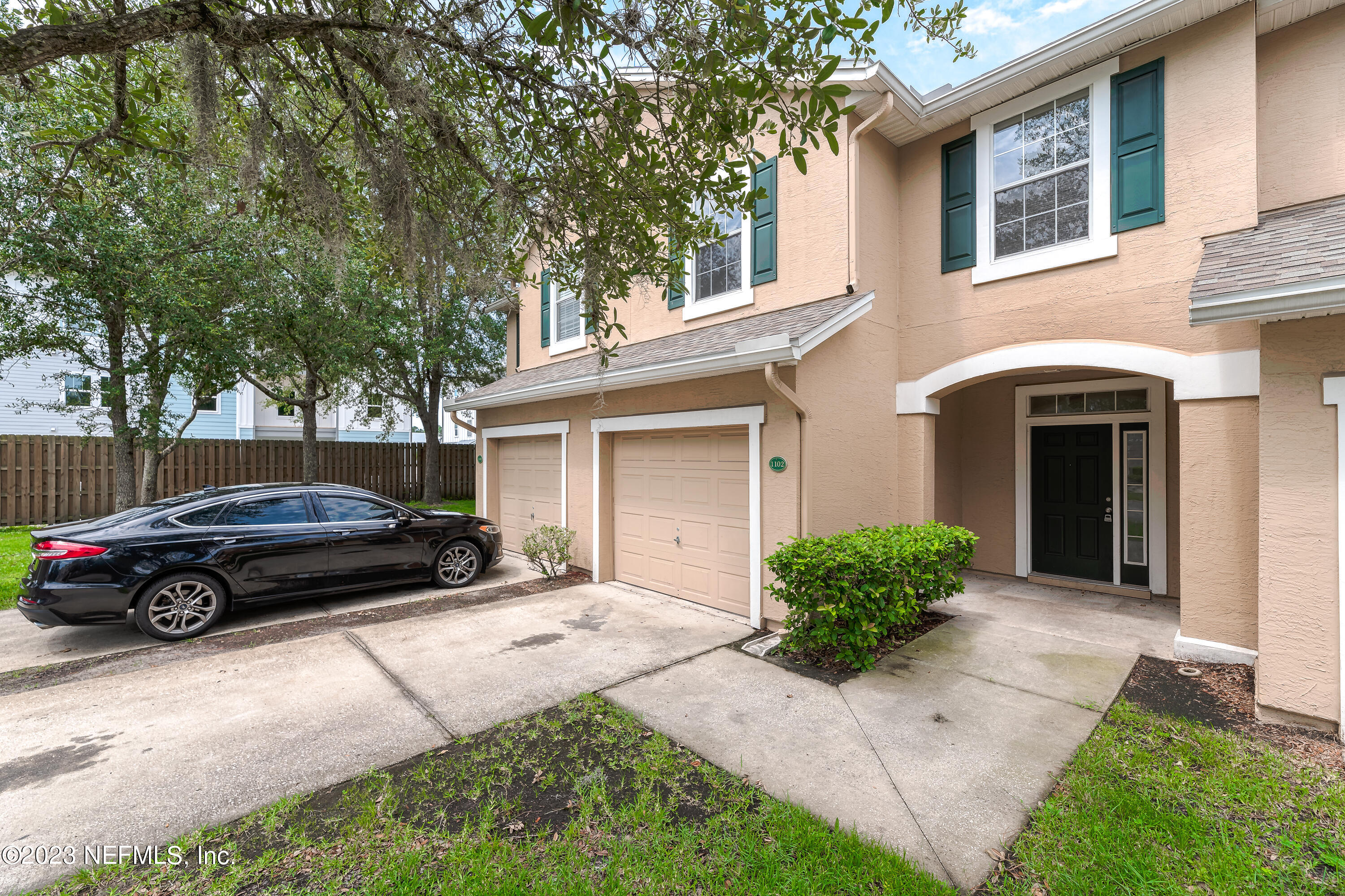 5260 Collins Road, Unit 1102 Jacksonville, FL 32244 - Photo 23 of 23 a car parked in front of a house
