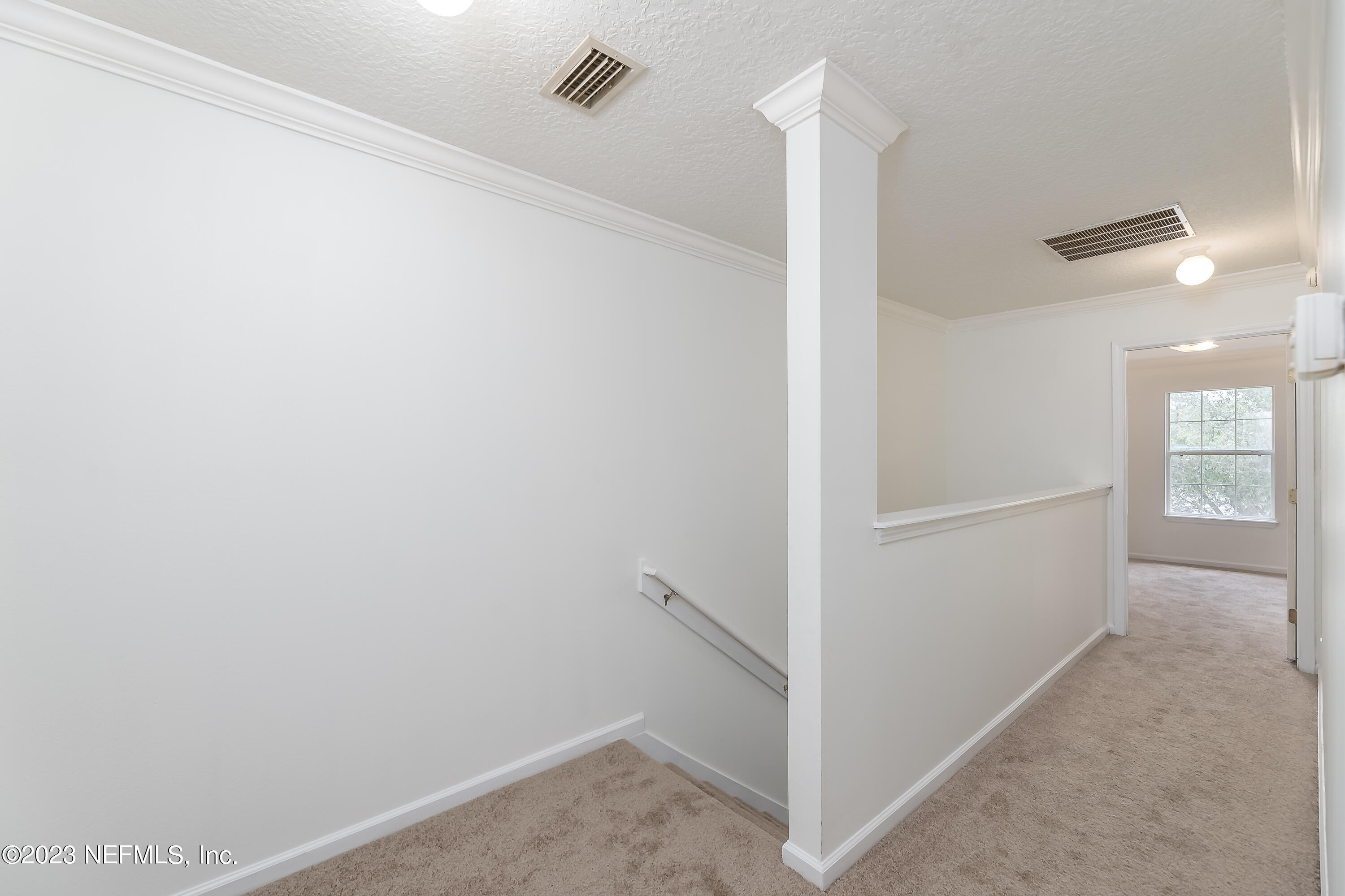 5260 Collins Road, Unit 1102 Jacksonville, FL 32244 - Photo 9 of 23 a view of a hallway with closet