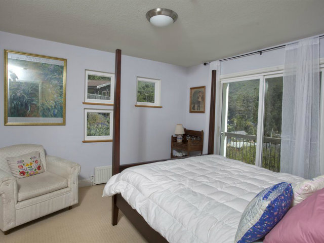 104 Nataqua Avenue Pacifica, CA 94044 - Photo 15 of 17 a bedroom with a large bed and a window