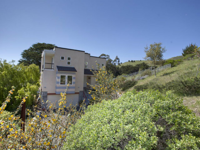 104 Nataqua Avenue Pacifica, CA 94044 - Photo 2 of 17 a front view of a house with a yard