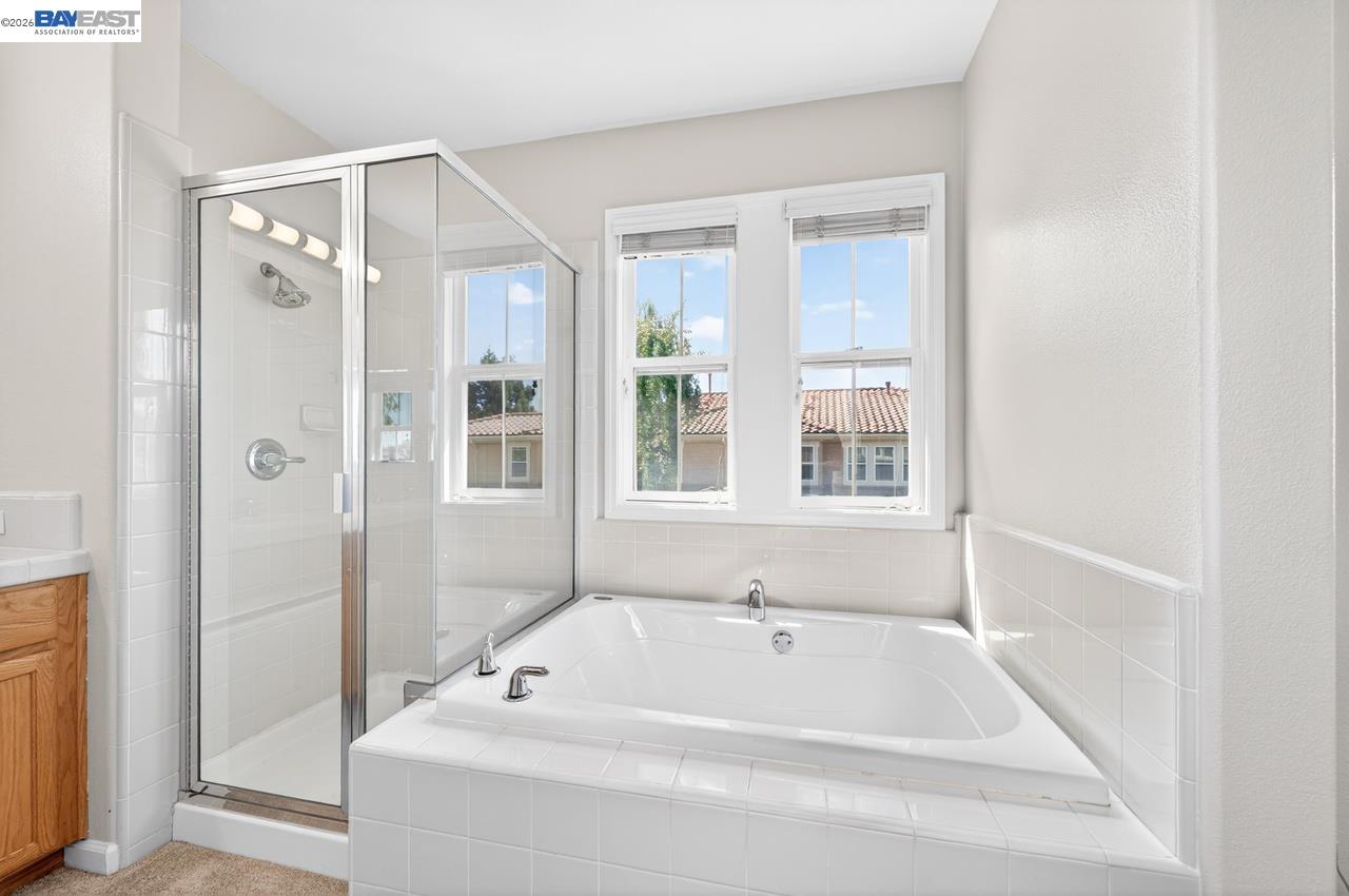 3391 Monaghan Street Dublin, CA 94568 - Photo 24 of 57 a bathroom with a bathtub and a shower