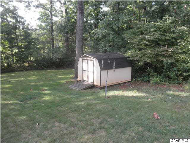 67 Rudolph Street Ruckersville, VA 22968 - Photo 10 of 40 a backyard of a house with lots of green space and fog