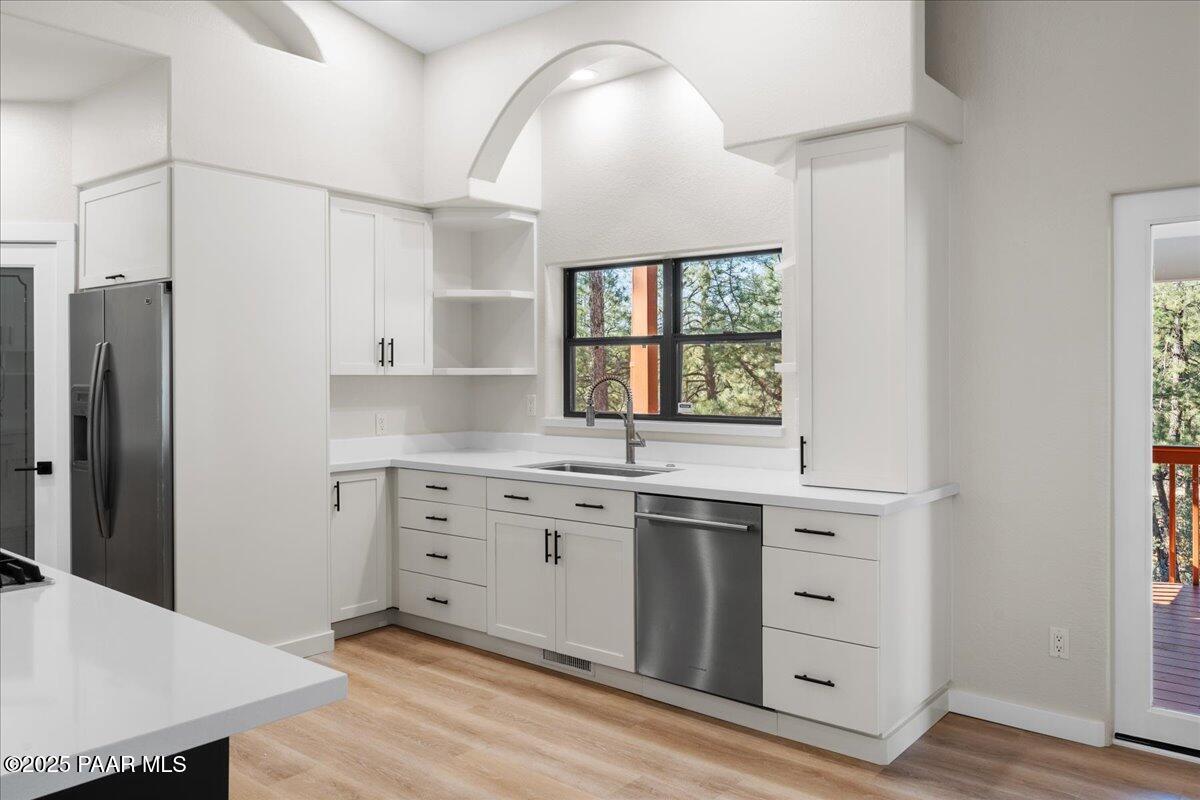 345 Banning Creek Road Prescott, AZ 86303 - Photo 14 of 41 a kitchen with a sink stove and refrigerator