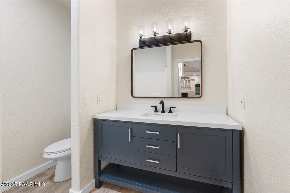 345 Banning Creek Road Prescott, AZ 86303 - Photo 24 of 41 a bathroom with a toilet sink and mirror