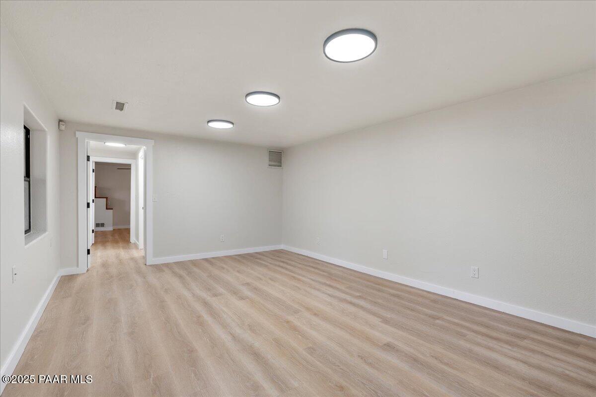 345 Banning Creek Road Prescott, AZ 86303 - Photo 28 of 41 a view of an empty room and wooden floor