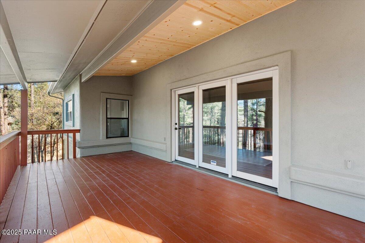 345 Banning Creek Road Prescott, AZ 86303 - Photo 34 of 41 a view of empty room with wooden floor and fan