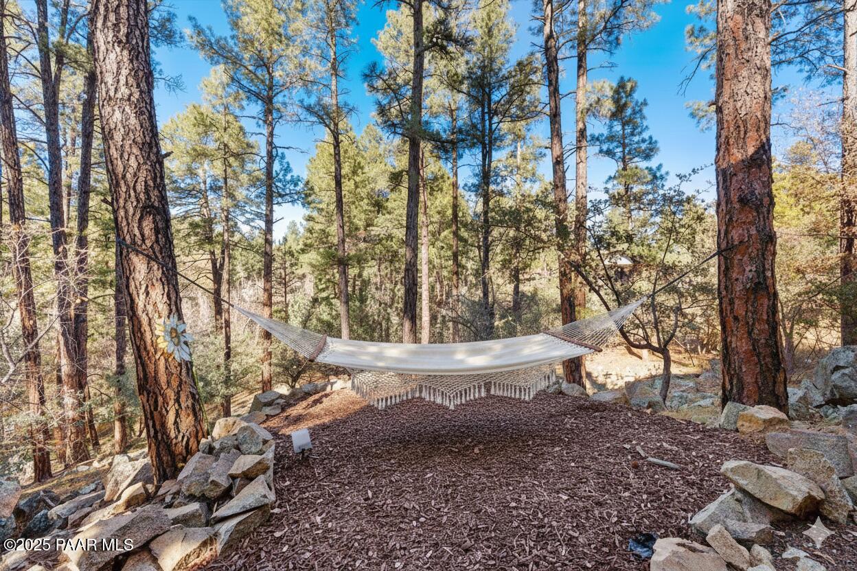 345 Banning Creek Road Prescott, AZ 86303 - Photo 40 of 41 a view of a backyard with large trees