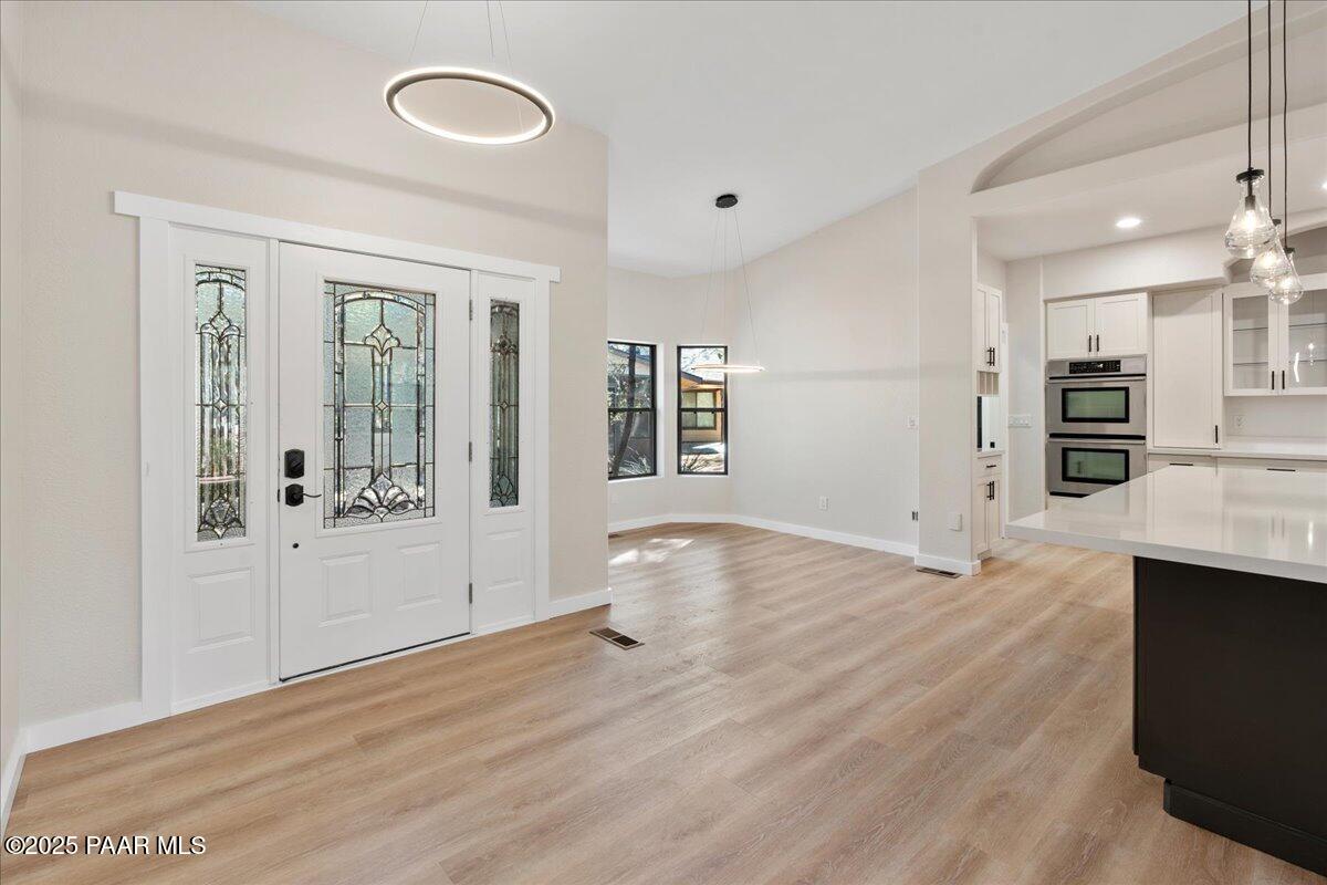 345 Banning Creek Road Prescott, AZ 86303 - Photo 5 of 41 a view of a kitchen with furniture and wooden floor