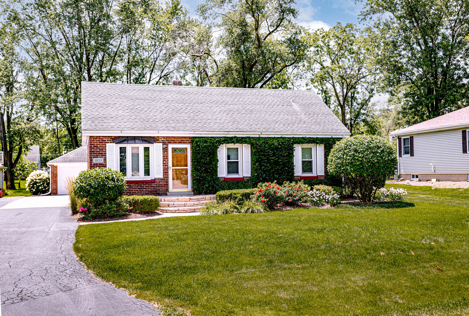 11133 Revere Road Mokena, IL 60448 - Photo 2 of 22 a front view of a house with garden