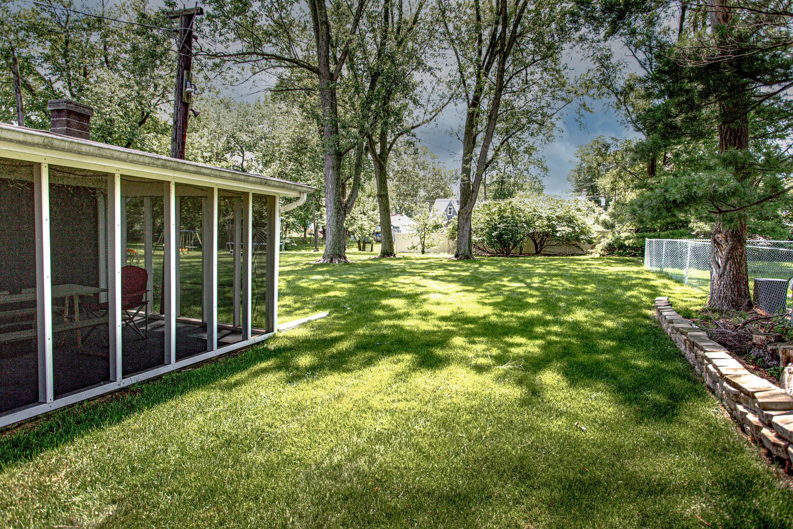11133 Revere Road Mokena, IL 60448 - Photo 7 of 22 a view of a backyard with large trees