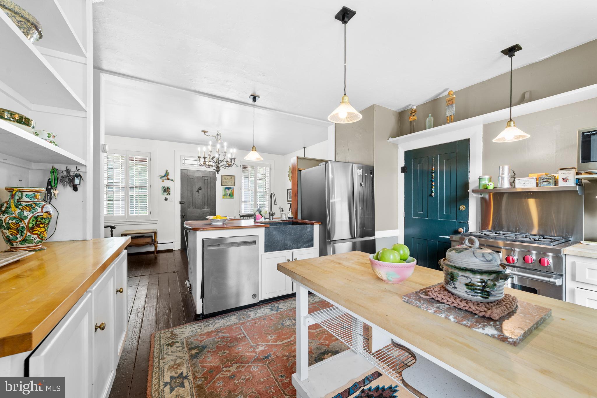 327 East Street Road Kennett Square, PA 19348 - Photo 15 of 41 a kitchen with sink refrigerator and cabinets