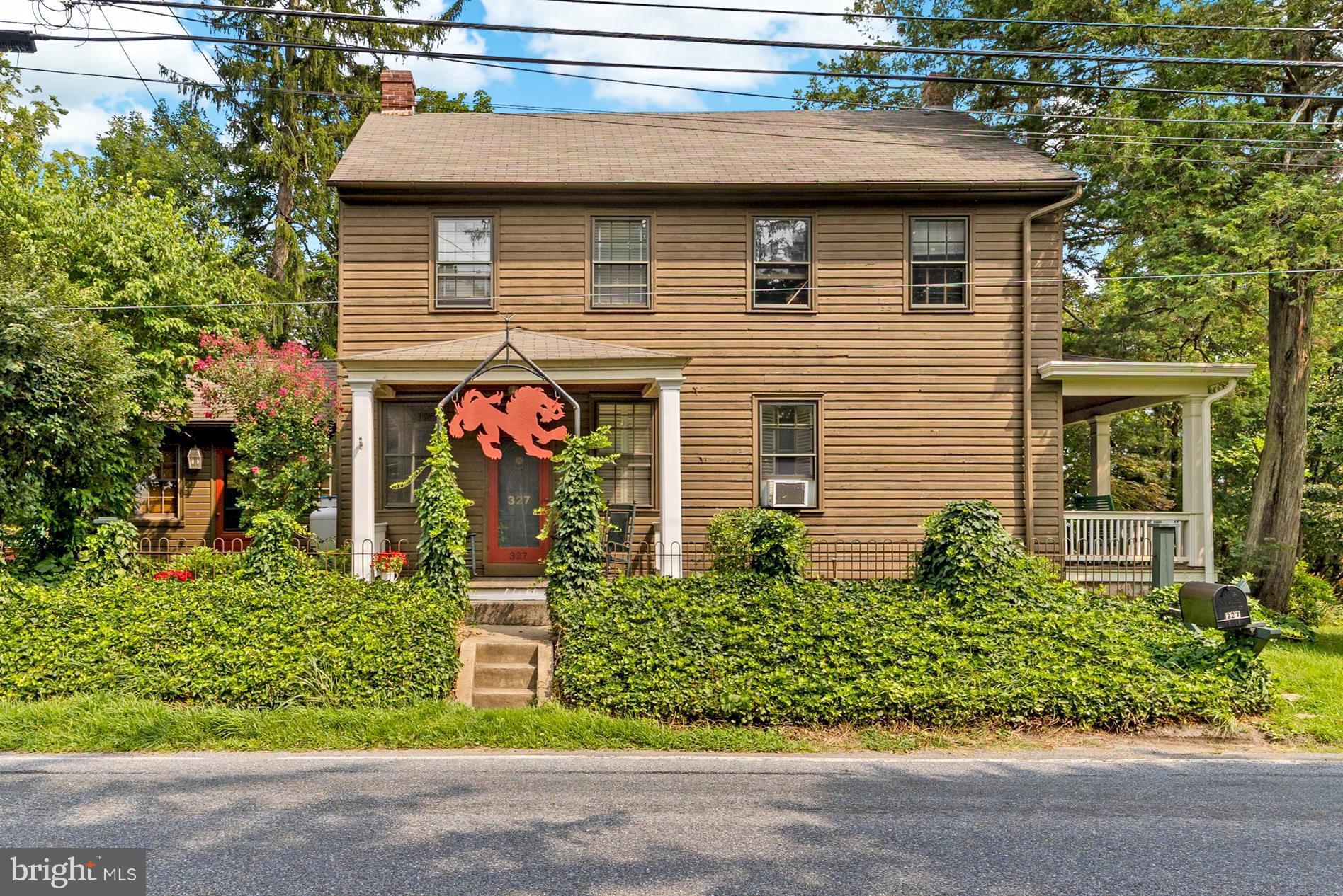 327 East Street Road Kennett Square, PA 19348 - Photo 2 of 41 a front view of a house with a yard and potted plants