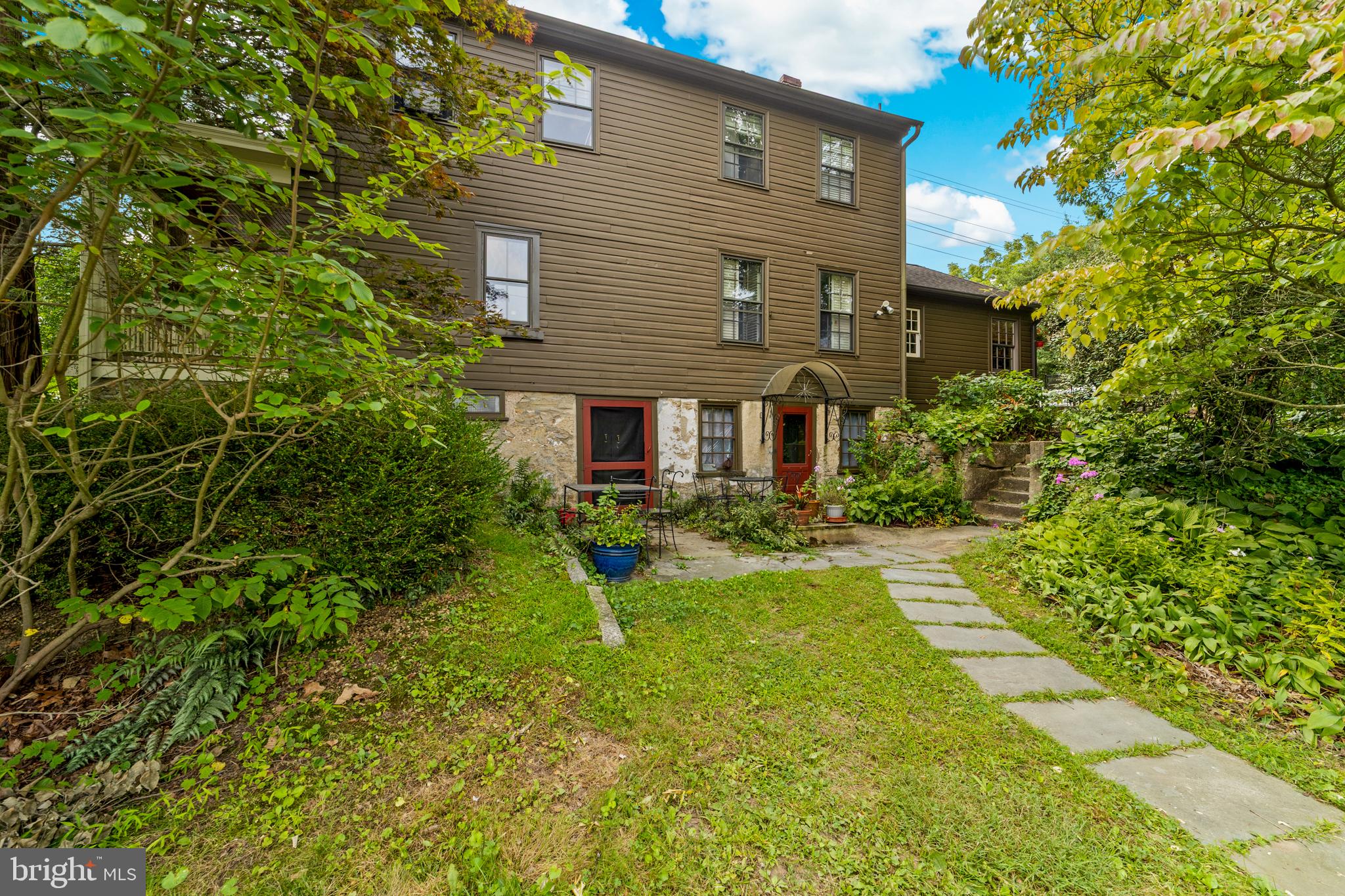 327 East Street Road Kennett Square, PA 19348 - Photo 5 of 41 a front view of a house with yard and green space