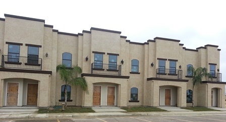 8216 Casa Verde Road, Unit E163 Laredo, TX 78041 - Photo 1 of 20 a front view of a building with yard