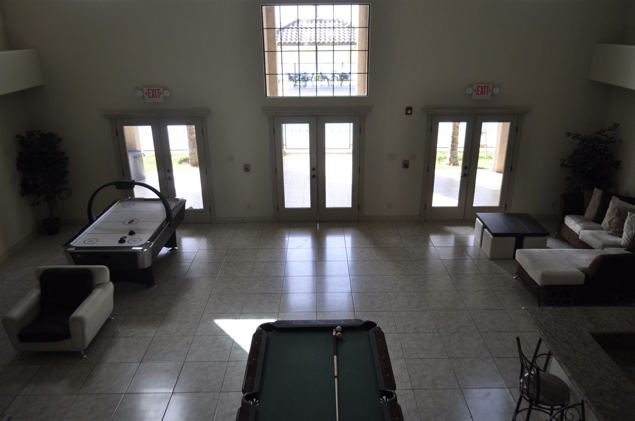 8216 Casa Verde Road, Unit E163 Laredo, TX 78041 - Photo 12 of 20 a lobby with furniture and floor to ceiling window