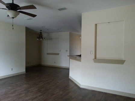 8216 Casa Verde Road, Unit E163 Laredo, TX 78041 - Photo 3 of 20 a view of empty room with wooden floor
