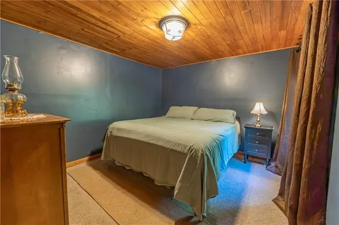 a bedroom with a bed and a table in it