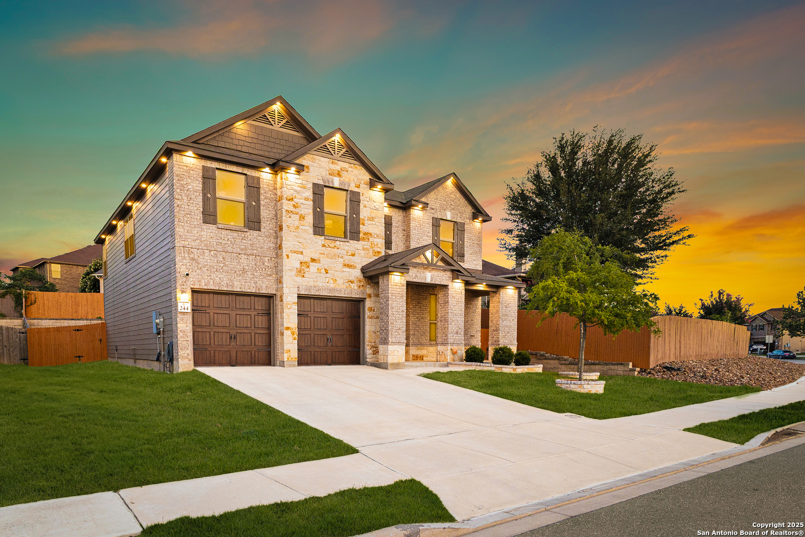244 Landmark Way Cibolo, TX 78108 - Photo 1 of 1 a front view of a house with a yard and garage