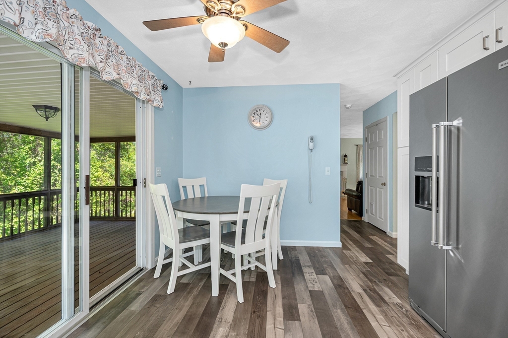 218 Acropolis Road Lowell, MA 01854 - Photo 13 of 39 a view of a dining room with furniture window and wooden floor
