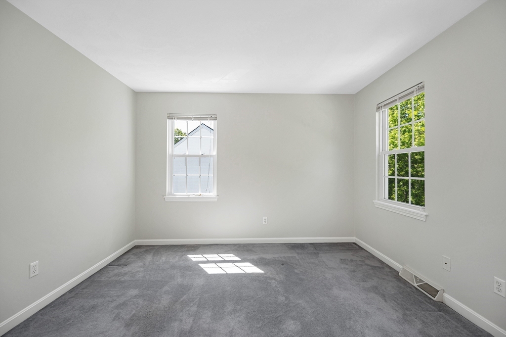 218 Acropolis Road Lowell, MA 01854 - Photo 24 of 39 an empty room with a window