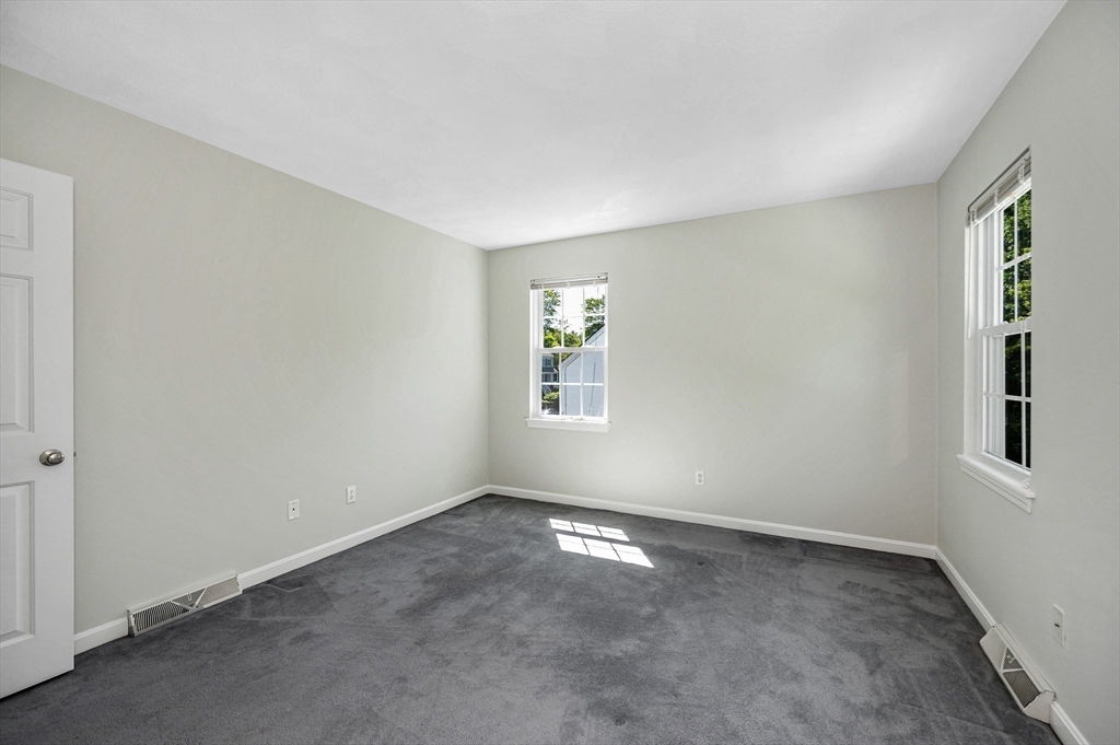218 Acropolis Road Lowell, MA 01854 - Photo 25 of 39 a view of an empty room with a window