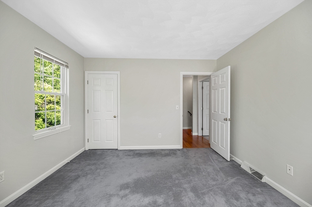 218 Acropolis Road Lowell, MA 01854 - Photo 26 of 39 a view of an empty room with a window