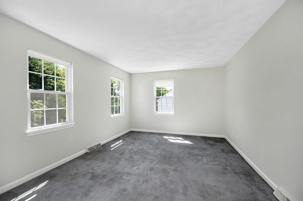 218 Acropolis Road Lowell, MA 01854 - Photo 27 of 39 an empty room with windows