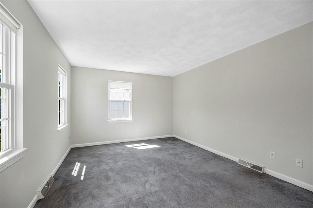 218 Acropolis Road Lowell, MA 01854 - Photo 28 of 39 an empty room with windows