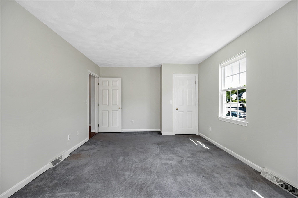 218 Acropolis Road Lowell, MA 01854 - Photo 29 of 39 an empty room with windows