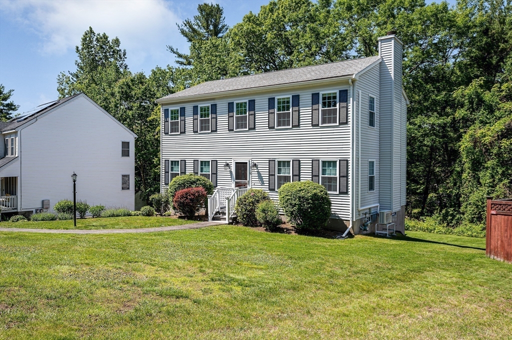 218 Acropolis Road Lowell, MA 01854 - Photo 30 of 39 a view of a house with yard and sitting area