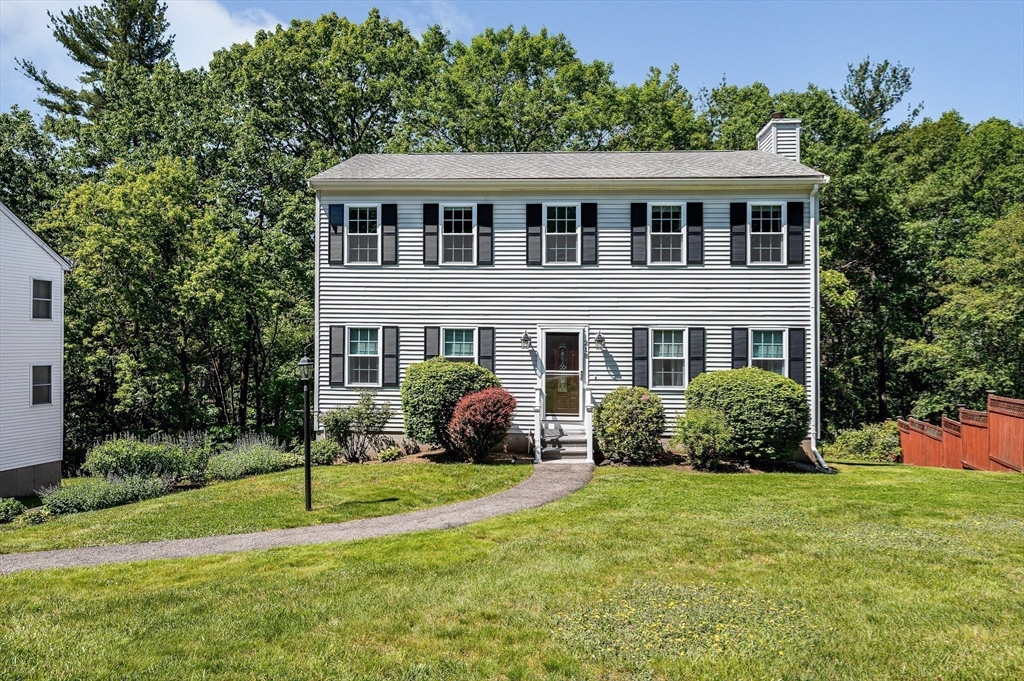 218 Acropolis Road Lowell, MA 01854 - Photo 31 of 39 a front view of a house with a yard
