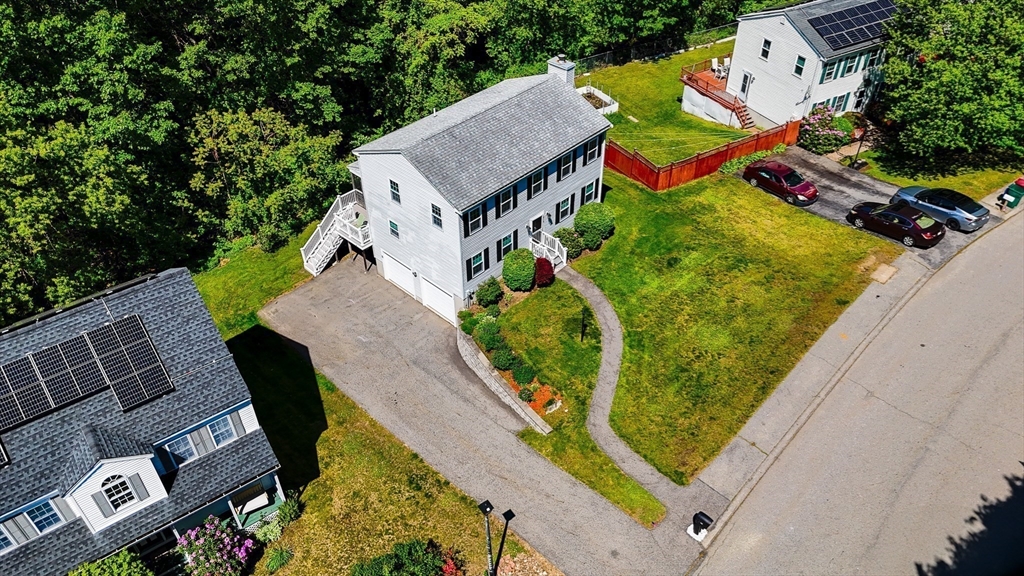 218 Acropolis Road Lowell, MA 01854 - Photo 33 of 39 an aerial view of a house with a swimming pool
